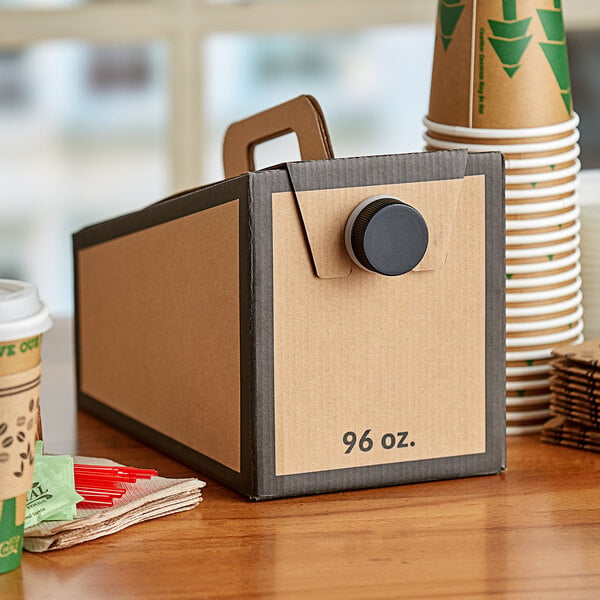 A cardboard box of Choice beverage containers on a table.