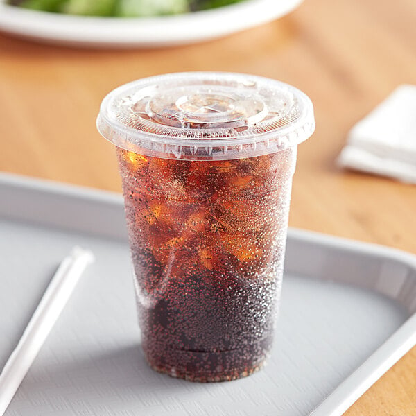 A Choice clear plastic cup filled with a drink.
