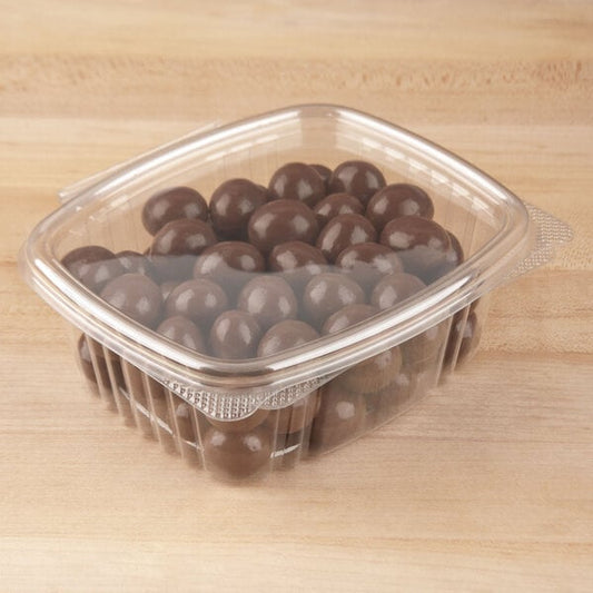 A Genpak clear plastic container filled with chocolate balls.