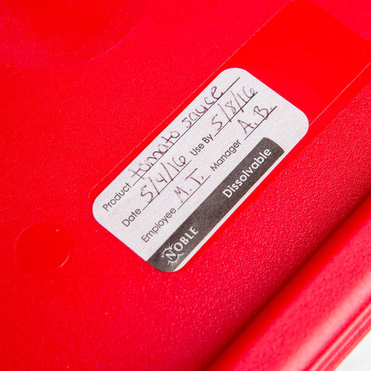 A red dispenser carton of Noble Products dissolvable food labels with a white label on a red container.